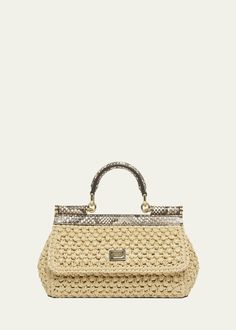 "Find DOLCE & GABBANA Sicily Small Python & Raffia Top-handle Bag on Editorialist. Dolce & Gabbana \"Sicily\" top handle bag in rayon/cellulose acetate, raffia, and python leather Top handle Detachable, adjustable crossbody strap Can be worn as a top handle or crossbody bag Flap top with magnetic closure; logo hardware Interior, one slip pocket Lining: Cotton Feet protect bottom of bag Approx. 5.1\"H x 7.8\"W x 2.3\"D Made in Italy" Elegant Beige Straw Bag With Bamboo Handle, Designer Beige Shoulder Bag With Bamboo Handle, Designer Straw Top Handle Bag, Designer Natural Straw Bag With Handles, Luxury Evening Straw Bag With Leather Handles, Designer Natural Straw Bag, Luxury Straw Bag With Leather Handles For Evening, Designer Beige Bag With Bamboo Handle, Luxury Straw Bag With Leather Handles