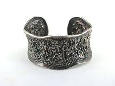 This is Vintage Floral Textured Cuff Bracelet Sterling Silver Br 414 Condition: Vintage Metal: Sterling (.925) Silver Weight: 44 grams Diameter: 6 in  Width: 37 mm Images you see are actual pictures of jewelry you will receive Every purchase comes thoughtfully packaged and ships within 1 business day New York State buyer will be charged sales tax Feel free to contact us with any questions. We are open Mon-Fri 9-5 EST We appreciate your business Classic Adjustable Cuff Bracelet With Intricate Design, Elegant Stamped Cuff Bracelet Bangle, Elegant Stamped Cuff Bracelet In Bangle Style, Elegant Stamped Silver Cuff Bracelet, Elegant Wide Band Stamped Jewelry, Elegant Antique Silver Cuff Bracelet With Oxidized Finish, Formal Oxidized Bangle Cuff Bracelet, Antique Silver Adjustable Cuff Bracelet For Formal Occasions, Formal Adjustable Antique Silver Cuff Bracelet