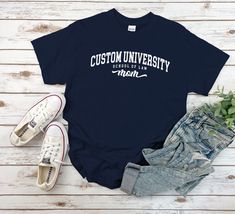 "Custom School of Law University Mom Shirt, Cool Cozy University Mom Gift Tshirt for Mens and Women available in 10 color ; Black, White Navy, Sport Grey, Royal Blue, Irish Green, Red, Natural, Military Green, Dark Chocolate. This shirt using USA standard size; S, M, L, XL, 2XL, 3XL, 4XL. Tee Spec's Using Direct to Garment (DtG) for quality and durability print. Using semi-fitted tee full cotton for cool & comfort t-shirt. * 100% ring-spun cotton * Pre-shrunk for extra durability * Shoulder-to-shoulder taping * Quarter-turned to avoid crease down the center. Size Chart S 18\" with 28\" length M 20\" with 29\" length L 22\" with 30\" length XL 24\" with 31\" length 2XL 26\" with 32\" length 3XL 28\" with 33\" length 4XL 30\" with 34\" length 5XL 32\" with 35\" length Handling time After cle Casual T-shirt With Custom Text For College, Casual Custom Text T-shirt For College, Casual College T-shirt With Custom Text, Casual Cotton T-shirt With Custom Text, Casual Cotton Tops With Custom Text, Law University, School Of Law, Nursing School Gifts, University Shirt