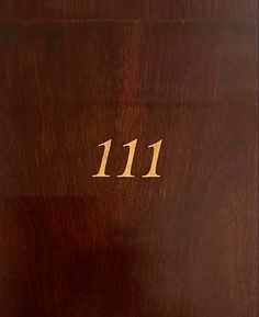 a wooden door with the number 11 on it