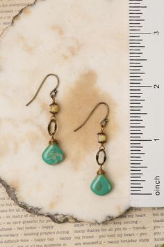 These handcrafted earrings are longer in design with an antique brass hoop and a stunning Czech glass focal. They are completed with antique brass ear wires and hang at approximately 1.5" in length. Antique Brass (lead and nickel free) Czech Glass 1.5", with antique brass ear wires We hand select our natural materials, thus there may be slight variations in color and/or size that will not detract from the overall aesthetic Our unique handcrafted designer jewelry for women in made in America, eac Floyd Va, Designer Handmade Jewellery, Brass Hoops, Long Dangle Earrings, Handcrafted Earrings, Designer Jewelry, In Design, Ear Wires, Czech Glass