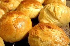 some bread rolls sitting on top of a counter next to each other in a pile