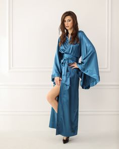 Irresistible in its classic kimono-cut design, this silky robe, seemingly tailored for women, is actually a versatile unisex garment suitable for both men and women alike. Featuring a satin finish, its dramatic sweeping hem and draped sleeves create a captivating silhouette. This piece, with its traditional tailoring and sophisticated essence, makes for an ideal gift, bringing luxury to every morning. ✓ garment length - 147 cm/58'' ✓ wrap over style ✓ two sets of inside ties ✓ wide obi-tie is in Fancy Robe, Fancy Robes, Satin Dressing Gown, Robe Silk, Robe Women, Luxury Robes, Silky Robe, Draped Sleeves, Luxury Loungewear