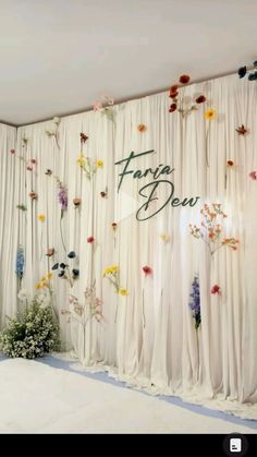 a room with flowers on the wall and drapes covering it's walls that say faraway dew