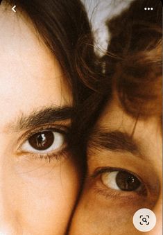 a close up of two people's eyes, one with long hair and the other without