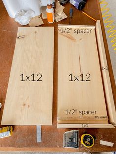 two pieces of wood sitting on top of a table