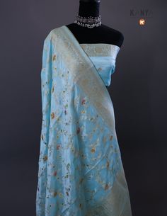 Indulge in luxury and elegance with our Pure Banarasi Crepe Silk Saree in an exquisite Ocean Blue color. Handcrafted with intricate designs, this saree is an opulent addition to your wardrobe. Experience the soft, lightweight fabric and look effortlessly stunning at any occasion. Elevate your style with this timeless piece. Blue Dola Silk Pre-draped Saree With Zari Weaving, Elegant Blue Pre-draped Saree With Zari Weaving, Elegant Jamawar Pre-draped Saree For Wedding, Blue Wedding Pre-draped Saree With Zari Weaving, Elegant Wedding Pre-draped Jamawar Saree, Blue Jamawar Pre-draped Saree With Zari Weaving, Elegant Blue Banarasi Silk Pre-draped Saree, Blue Silk Anarkali Pre-draped Saree, Festive Light Blue Saree For Reception