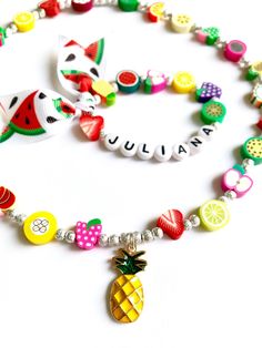 Hello everyone, welcome to my shop. This is a personalized/customized fruit stretch bracelet and necklace set for little girls. Perfect for girls as everyday summer jewelry. I will choose random fruits and ribbons to make your bracelet, I will always try to get as close as possible to original but stock may vary. I will need to know the name of your child (leave me a note at checkout section) and your child's wrist. (in inch- find your size in the menu) Can be made without the ribbon, leave me a Playful Summer Jewelry For Gifts, Playful Summer Jewelry Gift, Summer Beach Jewelry With Fruit Design, Playful Summer Jewelry As A Gift, Summer White Jewelry With Fruit Design, Summer Fruit Design White Jewelry, Fun Summer Necklaces For Gifts, Cheerful Adjustable Jewelry For Gifts, Sweet Personalized Adjustable Jewelry