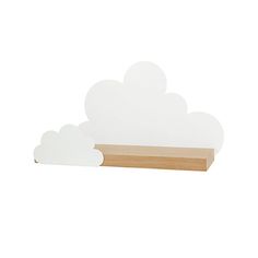 a wooden shelf with two white clouds on it