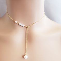 Beautiful Paris Pearl Necklace Condition: New Material:Gold Plated Length: 16in With 3in Extender White Adjustable Lariat Jewelry, Adjustable Pearl White Jewelry With Clavicle Chain, Elegant White Jewelry With Adjustable Length, Adjustable Clavicle Chain In Pearl White, Dainty White 16-inch Jewelry, White Pearl Lariat Necklace With Clavicle Chain, White Pearl Choker With Delicate Chain, Minimalist White Lariat Pearl Necklace, Elegant White Necklace With Adjustable Length