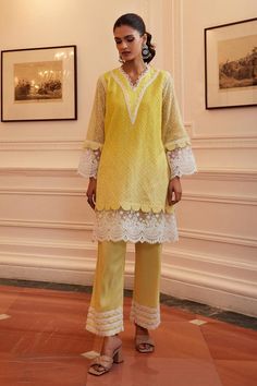 Yellow kurta with thread embroidery in geometric pattern and lace embellished scallop border. Paired with pant. Components: 2 Pattern: Embroidery Type Of Work: Thread, geometric Neckline: V neck Sleeve Type: Full sleeves Fabric: Cotton Chanderi Color: Yellow Other Details:  Length: Kurta: 36 inches Pant: 38 inches Sleeves: 22 inches Occasion: Mehendi and Haldi - Aza Fashions Yellow Cotton Suit, Cotton Suit Designs, Full Sleeves Design, Yellow Kurta, Scallop Border, Yellow Suit, Coord Set, A Line Kurta, Yellow Pants