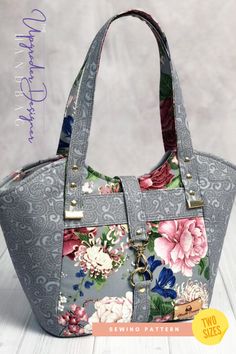 a purse with flowers on it sitting on top of a table