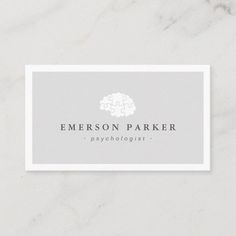 a white business card with the words emerson parker on it, and a gray background