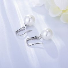 Looking for a pair of earrings that exude elegance and sophistication? Look these earrings feature high-quality, lustrous pearls that sit delicately on the ear, creating a refined and understated look that is perfect for any occasion. They are simple yet stylish, and designed to complement any outfit – from a formal gown to jeans and a t-shirt. Style: Women Metal Material: S925 Sterling Silver Pearl Type: Uncultured Pearl Color: White Pearl Shape: Round Earring Weight: 3.6g Earring Length:2.46cm