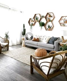 a living room filled with furniture and potted plants