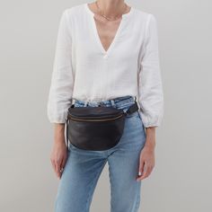 Our favorite way to be handsfree is always with a belt bag. Juno is perfectly sized for everything you need for the day. Now, just go where you want to be Juno Belt Bag In Smooth Leather  Black BELT BAGSLING in Black | Hobo® Black Belt Bag, D Tan, Brushed Brass Hardware, Antique Brass Hardware, Leather Belt Bag, Leather Tassel, Adjustable Belt, Juno, Black Belt