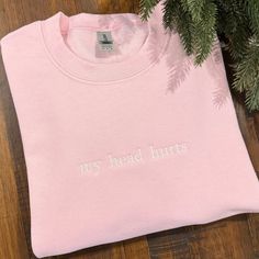 Made from soft blended material, this sweatshirt will keep you warm on cold winter nights.  Choose your color and size (see photos for color and size chart). All orders are stitched in the USA with love! If you do not choose a thread color, white or black will be stitched. Pink Hoodie With Embroidered Text For Winter, Winter Pink Hoodie With Embroidered Text, Winter Sweatshirt With Embroidered Logo, Pink Embroidered Hoodie For Winter, Winter Sweater With Letter Embroidery, Pink Embroidered Hoodie For Fall, Pink Crew Sweatshirt With Embroidered Graphics, Winter Crew Sweatshirt With Embroidered Logo, Winter Crew Neck Sweater With Letter Embroidery