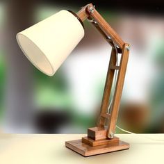 a desk lamp sitting on top of a table