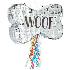 a dog bone shaped balloon with the word woof on it's side and colorful streamers