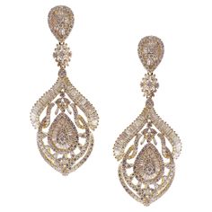 These pear curved chandelier earrings are crafted in 18-karat yellow gold, weighing approximately 11.71 total carats of SI-V Quality white diamond. French clip backing. Our Ballroom Chandelier Collection feature earrings for those with bold/classy aesthetics and elegant tastes. 370 Round Diamonds = 7.72 ct 190 Baguette Diamonds = 3.99 ct Luxury Antique Teardrop Earrings, Luxury Yellow Gold Pierced Chandelier Earrings, Luxury Yellow Gold Dangle Crystal Earrings, Luxury Traditional Yellow Gold Diamond Earrings, Ballroom Chandelier, Classy Aesthetics, Big Dangle Earrings, French Clip, Diamond Dangle Earrings