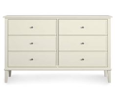 a white dresser with six drawers and two doors