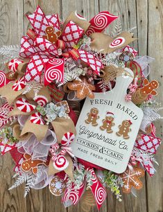 a christmas wreath with gingerbread cookies and candy canes