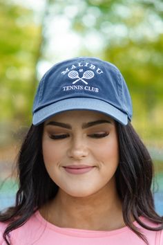 We want to see you in this cutie! This cap has a beautiful navy color and a sweet embroidered design that is perfect for the tennis lovers out there! The comfy fit and sleek design is great for all day wear! Casual Navy Hats For Sports Events, Navy Sporty Hat With Curved Visor, Sporty Navy Trucker Hat With Curved Bill, Navy Sporty Trucker Hat With Curved Bill, Sporty Blue Dad Hat, Navy Casual Dad Hat With Curved Visor, Casual Navy Dad Hat With Curved Visor, Sporty Blue Dad Hat With Embroidered Logo, Navy Casual Dad Hat For Sports