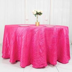 the table is covered with a bright pink cloth