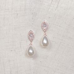 "Pretty Bridal Dangle Earrings for Bride, Bridal Teardrop Earrings, Drop Wedding Earrings, Teardrop Earrings Modern Wedding 💖 Our Current New Shop Promotion 💖 Get a free 2 pcs CZ Bobby Pin Set with every order! Order now and enjoy the added sparkle and elegance! (: Handcrafted with intricate detail, these earrings feature sparkling cubic zirconia accents that beautifully complement the lustrous simulated pearls. Whether you're a modern bride or a traditional one, these earrings are a versatile White Dangle Teardrop Earrings With Elegant Design, White Elegant Dangle Teardrop Earrings, White Elegant Teardrop Dangle Earrings, Delicate Drop Bridal Earrings With Matching Set, Teardrop Chandelier Earrings With Pearl Drop For Wedding, Teardrop Pearl Drop Wedding Earrings, Rose Gold Drop Earrings With Pearl Detail For Bridal, Rose Gold Bridal Drop Earrings With Pearl, Rose Gold Teardrop Wedding Earrings