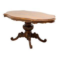 a wooden table with an oval shaped top