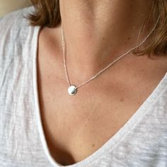 A pretty little minimalist and bright 925 silver necklace. o Size of the medallion: 1 cm. o Chain length: 40 to 45 cm (adjustable). Everything is in solid 925/1000 silver Made in France. Simple and light, this pretty little necklace in solid 925/1000 silver is easy to wear. Discreet and bright, it brings a touch of originality to your neck. It can be worn every day as well as to dress up a pretty evening dress. It can be worn alone or stacked with other necklaces from the same collection. It is suitable for all styles and all ages. The small medallion is on a silver chain which is adjustable from 40 to 45 cm. It's all solid 925 silver, so you can wash with it. It was created and handcrafted in my workshop in Paris. It comes packaged in a pretty fabric pouch. It is possible to add gift wrap Fine Necklace, Lost Wax Casting, Pretty Fabric, Silver 925 Necklace, Necklace For Women, Chain Lengths, Favorite Jewelry, Silver Chain, Womens Necklaces