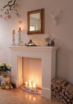 a living room with a fire place filled with candles