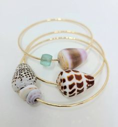 Hey, I found this really awesome Etsy listing at https://www.etsy.com/listing/118647648/shell-bangles-in-gold-set-of-3-bangles Shell Bangles, Bangle Stack, Apt Decor, Jewelry Pearls, Mermaid Aesthetic, Seashell Jewelry, Puka Shell, List Ideas, Shell Bracelet