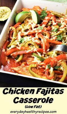 chicken fajitas casserole in a white dish with limes and cilantro