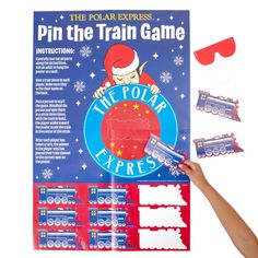 the polar express pin the train game is being held up by someone's hand