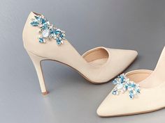 "Fun and flirty sparkly shoe clips made with the finest Premium European Crystal in the shades of aquamarine and dusty blue mixed with clear crystals. Unique design with flexible appliques that adjust nicely to the curve of the shoes. Each clip measures 2 1/2\" long and 1 1/2\" wide. Available in gold, rose gold or silver finish. Shown in the silver finish in the listing. Easy to use clip-on style. The price includes one pair of clips. - This listing is for the shoe clips only." Crystal Outfit, Shoe Embellishments, Bird Shoes, Bridal Shoe, Glass Shoes, Sparkly Shoes, Crystal Belt, White Wedding Shoes, Rhinestone Shoes