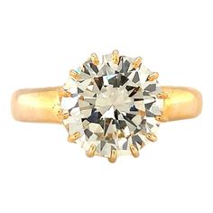 This magnificent 1960s engagement ring is a breathtaking blend of antique charm and timeless elegance, expertly crafted in 14K yellow gold. At its heart lies a dazzling 3.32-carat round brilliant-cut diamond, certified by GIA (Report No. 2211777954) with an O-P color and exceptional VS-1 clarity. The diamond's warm hue and stunning clarity radiate a captivating sparkle, making it the perfect centerpiece. The antique-style claw mount adds a touch of vintage sophistication, beautifully showcasing 1960s Engagement Ring, Brown Diamond Engagement Ring, Antique Diamond Engagement Rings, Edwardian Engagement Ring, Contemporary Engagement Rings, Yellow Gold Wedding Ring, Diamond Engagement Wedding Ring, Vintage Inspired Jewelry, Gold Rings Fashion