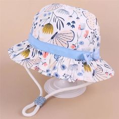 Summer Baby Hat: Stylish Sun Protection for Your Little Explorer Elevate your baby's summer style with our exquisite Summer Baby Hat. Crafted from high-quality cotton, this hat not only offers effective sun protection but also adds a touch of style to your little one's outfit. The adjustable strap ensures a secure and comfortable fit, making it suitable for babies aged 12 months to 8 years. Key Features: Stylish Design: Our Summer Baby Hat boasts a trendy and fashionable design, ensuring your li Baby Hat Size Chart, Summer Child, Baby Hat Sizes, Kids Bucket Hat, Girls Sun Hat, Baby Activity Center, Girls Hat, Baby Outerwear