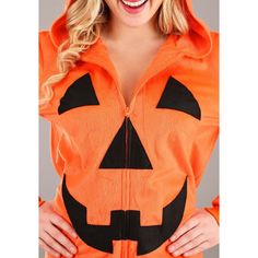 a woman wearing an orange halloween costume with a jack - o'- lantern on it