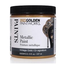 gold metallic paint in a jar on a white background