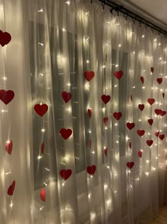 the curtains are decorated with lights and hearts