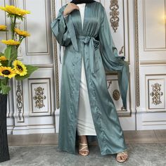 Abaya, Muslim Dress, Open Abaya Solid Long Sleeve Maxi Dress For Eid, Solid Long Sleeve Dresses For Eid, Elegant Long Thobe For Fall, Fall Solid Color Maxi Length Abaya, Elegant Green Spring Abaya, Modest Long Sleeve Thobe For Spring, Solid Color Long Maxi Dress For Eid, Fitted Solid Maxi Length Abaya, Long Sleeve Green Abaya For Spring