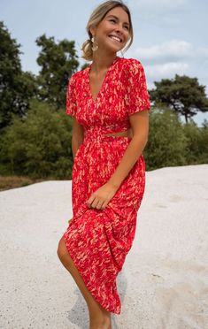 Red patterned maxi dress with beautiful short flared sleeves paired with a lush v-neckline in addition to feminine cut out detailing on the sides going to the back with an adjustable bow to tie. This dress has lining and is flowy and airy which is perfect for the summertime, in addition to having elastic band on the back for stretch and comfort. Lined Sizes: S-M / M-L S-M: Length 49.21 in - Width 11.81 inM-L: Length 50.39 in - Width 12.99 in Contexture: 100% polyester Washing: on delicate settin Europe Summer Dress, Wedding Guest Dress Summer Beach, Trip Fits, Clothes Europe, Women's Summer Dresses, Patterned Maxi Dress, Claudia Dress, Spanish Dress, Mom Wardrobe