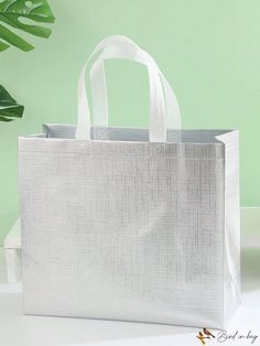 BirdinBag - Portable Metallic Non-Woven Tote Bag for Stylish Shopping Experience Reusable White Rectangular Shoulder Bag, Reusable Rectangular White Shoulder Bag, Recyclable Square Shopping Bag, Square Reusable Bags For Daily Use, Rectangular Bags With Reinforced Handles For Errands, Punk Bag, Woven Tote Bag, Style Punk, Word Wrap