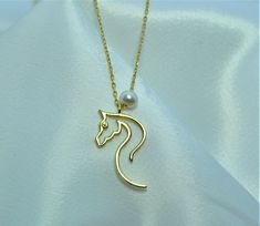 "10K 14K 18K Gold Horse Necklace, Design Horse Necklace, Equestrian Pendant, Handmade Necklace, Gift For Her, Horse Necklace With Pearls, Christmas Gift, Valentines Day Gift, Mothers Day Gift, Birthday Gift All jewelry in our collection are real solid gold and completely handmade accessories. The jewelry in our collection, which is an accessory with a bright and eye-catching beauty that will make others notice you and your loved ones in the environments you enter, is a great gift option to add v Elegant Horse Design Necklace As Gift, Elegant Necklace With Horse Design As A Gift, Classic Necklace With Horse Design For Gift, Elegant Formal Necklace With Horse Design, Classic Horse Design Pendant Necklace, Elegant Horse Design Pendant Jewelry, Formal Horse Design Pendant Jewelry, Elegant Sterling Silver Jewelry With Horse Design, Elegant Gold Jewelry With Horse Design