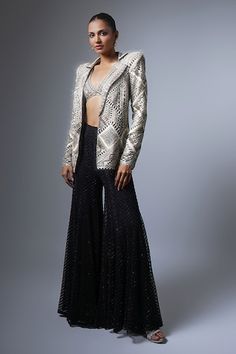 Black blazer with all over geometric cut work pattern, gold threads and crystal bugle beads embroidery. Paired with embroidered flared sharara with all over chevron pattern and embroidered plunged V neck padded blouse. - Aza Fashions Embellished Front Open Party Sets, Elegant Party Palazzo Set With Cutdana Details, Elegant Front Open Sharara For Parties, Elegant Front Open Party Choli, Festive Front Open Sharara For Party, Elegant Handwork Palazzo Set For Festive Occasions, Elegant Handwork Palazzo Set For Festive Season, Elegant Festive Palazzo Set With Handwork, Party Choli With Resham Embroidery And Front Open Design