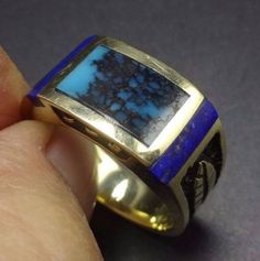 "VINTAGE NAVAJO GOLD & TURQUOISE RING DESCRIPTION: This exquisite ring features perfect inlay of tightly webbed turquoise, flanked with deep blue Lapis, on a foundation of heavy gauge 14 karat gold. This ring will be a treasured addition to your collection of the very finest vintage Native American jewelry. MEASUREMENTS: Ring face measures 7/16\" at the widest RING SIZE: 10 1/4 WEIGHT: 12.8 grams SIGNED: yes, but unreadable GOLD: yes, stamped 14K" Collectible Blue Multi-stone Turquoise Ring, Luxury Gold Jewelry With Inlay, Collectible Multi-stone Blue Turquoise Ring, Blue Art Deco Jewelry Stamped 14k, Luxury Blue Turquoise Ring For Formal Occasions, Formal Turquoise Ring In 14k Gold, Formal Gold Turquoise Ring In 14k Gold, Formal Turquoise Engraved Jewelry, Luxury Inlay Rings For Anniversary