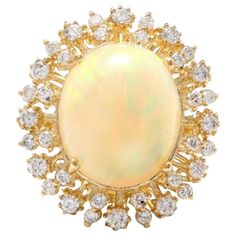 8.65 Carats Natural Impressive Ethiopian Opal and Diamond 14K Solid Yellow Gold Ring Total Natural Opal Weight is: Approx. 7.35 Carats Opal Measures: Approx. 15.00 x 12.50mm The head of the ring measures: Approx. 24.00 x 21.00mm Total Natural Round Diamonds Weight: Approx. 1.30 Carat (color G-H / Clarity SI1-SI2) Ring size: 7 (we offer free re-sizing upon request) Ring total weight: Approx. 7.1 grams Disclaimer: all weights, measurements and colors are approximate and may vary slightly from the Diamond Gold Ring, Etsy Gold Ring, Solid Gold Rings, Yellow Gold Ring, Natural Opal, Opal Jewelry, Quality Diamonds, Solid Yellow, Bright Yellow