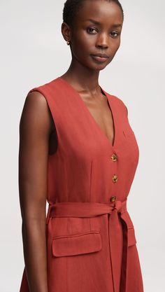 This easy, elevated midi dress in a lightweight linen twill makes for an effortless transition from spring to summer. Featuring besom pockets and an adjustable belt, the all-occasion dress is designed with vest details and a center-front button closure. Summer V-neck Belted Dress For Work, Elegant V-neck Linen Dress With Pockets, Formal Linen Belted Dress, Formal Belted Linen Dress, Summer Belted Dress With Button Closure For Work, Sleeveless Linen Dress For Spring Formal, Belted Midi Linen Dress For Work, Sleeveless Linen Spring Formal Dress, Summer Workwear Midi Dress Unlined