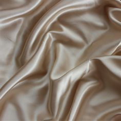 "Stretch Charmeuse Light Champagne, Silk by Yard, Silk Satin fabric, Luxurious Poly Silk for Gowns, Dress, Tapioca Silk for Bridesmaids, Our charmeuse satin is a wondrous fabric, it's shiny, silky, and soft, it moves like water - the drape is out of this world! This makes it perfect for items worn against the skin - luxurious gowns, bridal dresses, chemises, lingerie, camisoles, and robes, slinky evening wear, and silky covers. Whatever you make, it will be sure to be a sumptuous piece in your w Champagne Colour Aesthetic, Luxury Silk Modal Satin Dress For Women, Champagne Satin Wedding Dress, Luxury Dress Aesthetic, Silk Champagne Dress, Satin Champagne Dress, Silk Aesthetic, Champagne Silk Dress, Luxurious Gowns